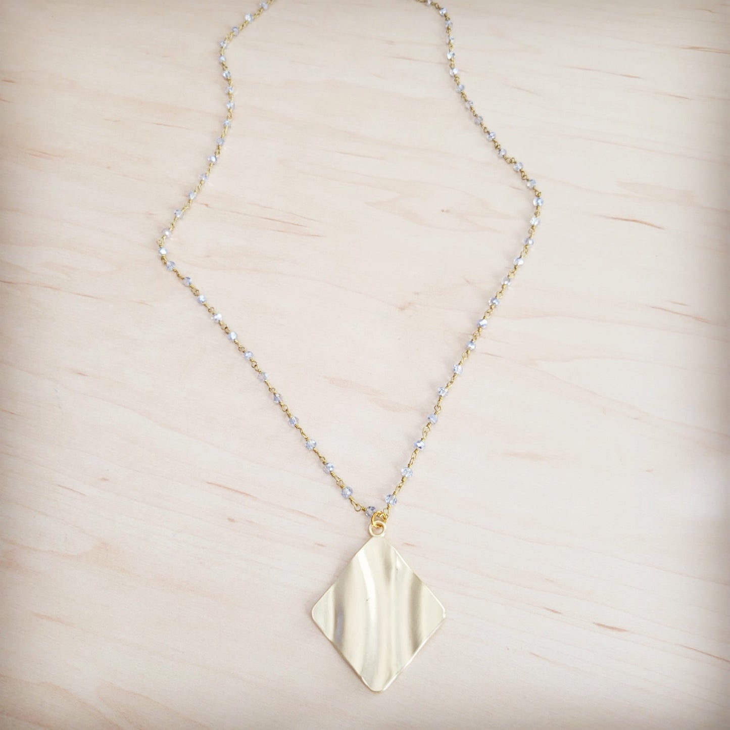 **Gilded Wave Pendant Necklace 257mb